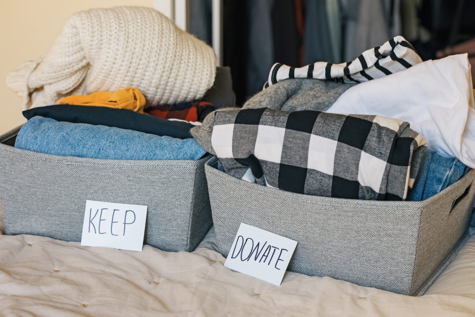 Seasonal clothes storage with keep and donate boxes for wardrobe organisation