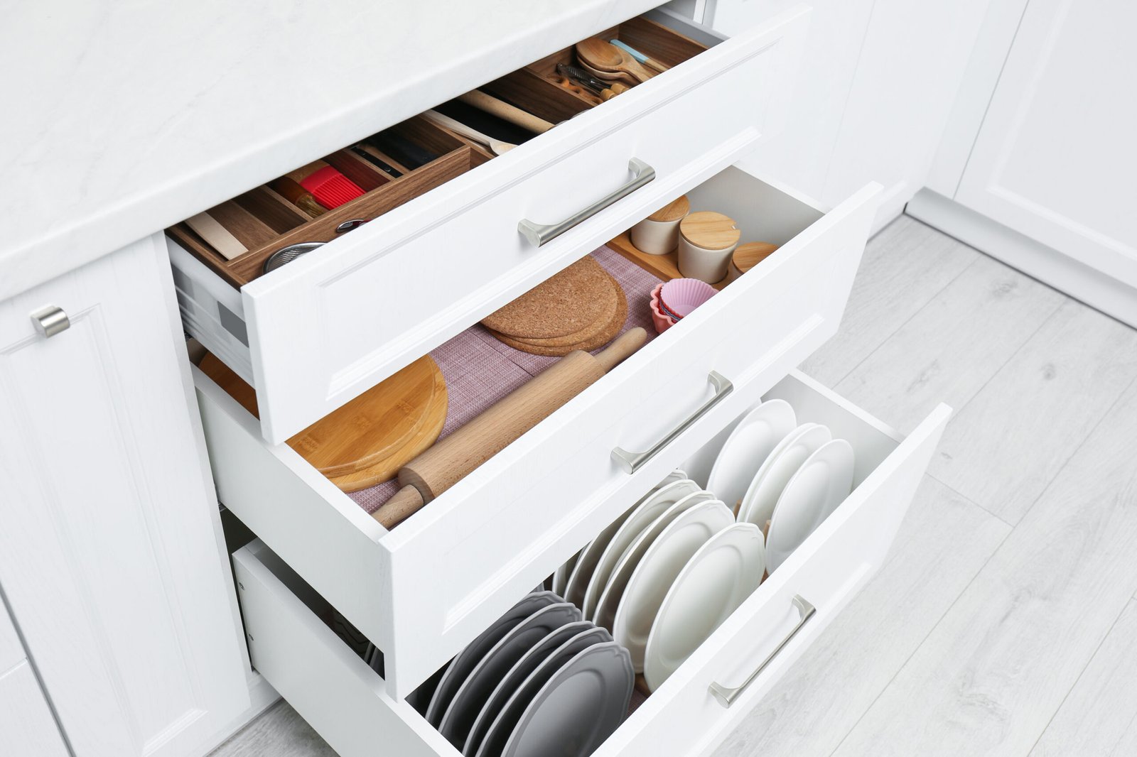 kitchen drawer organisation using dividers to prevent items sliding and overlapping