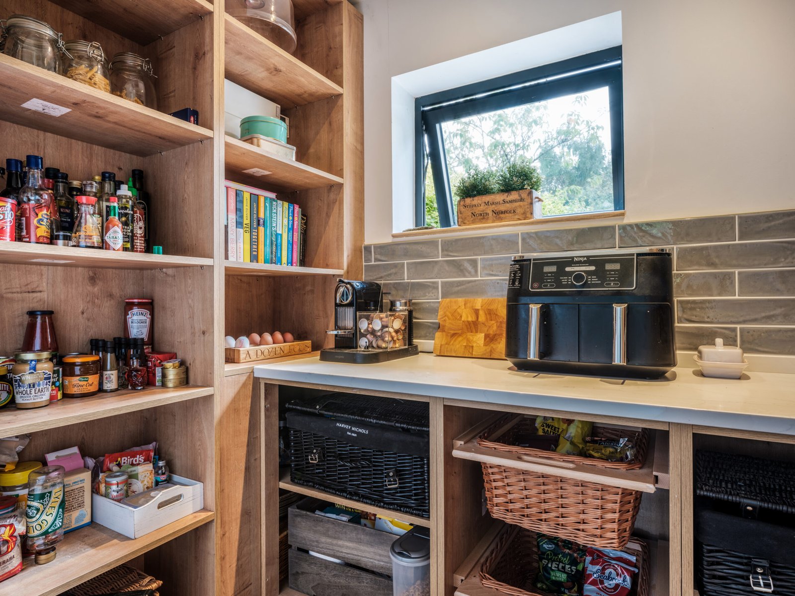 Pantry organisation ideas using shelves, baskets, and clear storage to keep food visible and accessible